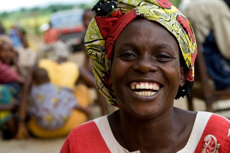 A smiling woman at a market
